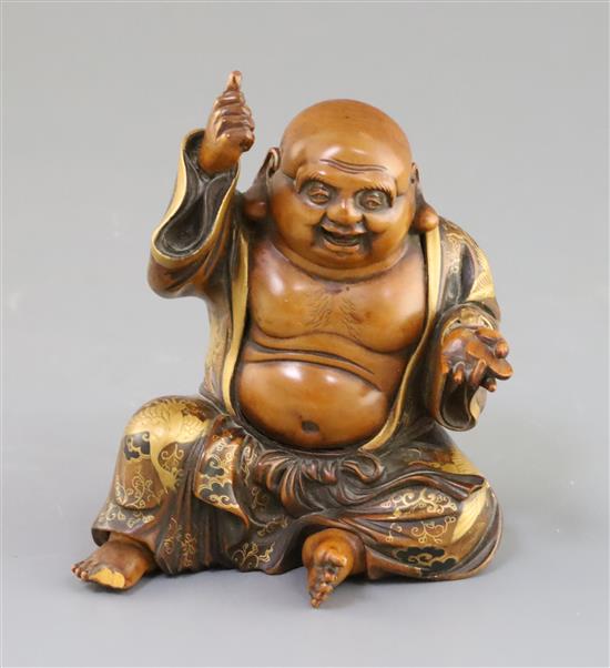 A Japanese wood and gilt lacquer figure of Hotei, Meiji period, H. 11.3cm, two toes lacking